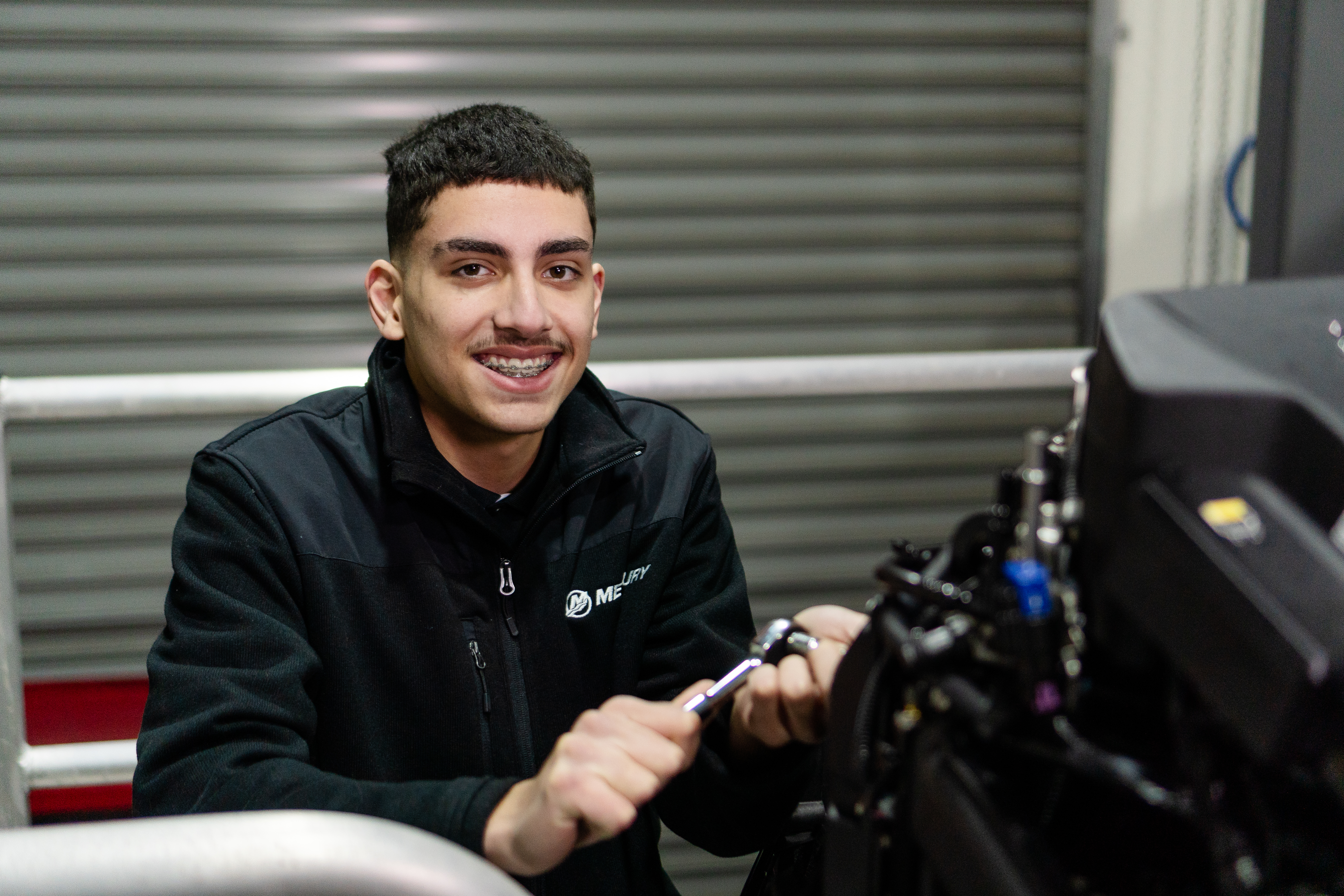 Joachim Lopez-Valoa Victorian Training Awards 2023 School-based Apprentice of the Year winner in workshop with spanner in his hand