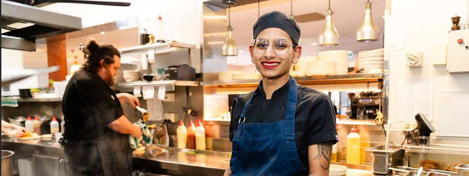 2023 Victorian Training Awards Apprentice of the Year Leela 2023 Victorian Training Awards Apprentice of the Year cooking in a kitchen over a stove