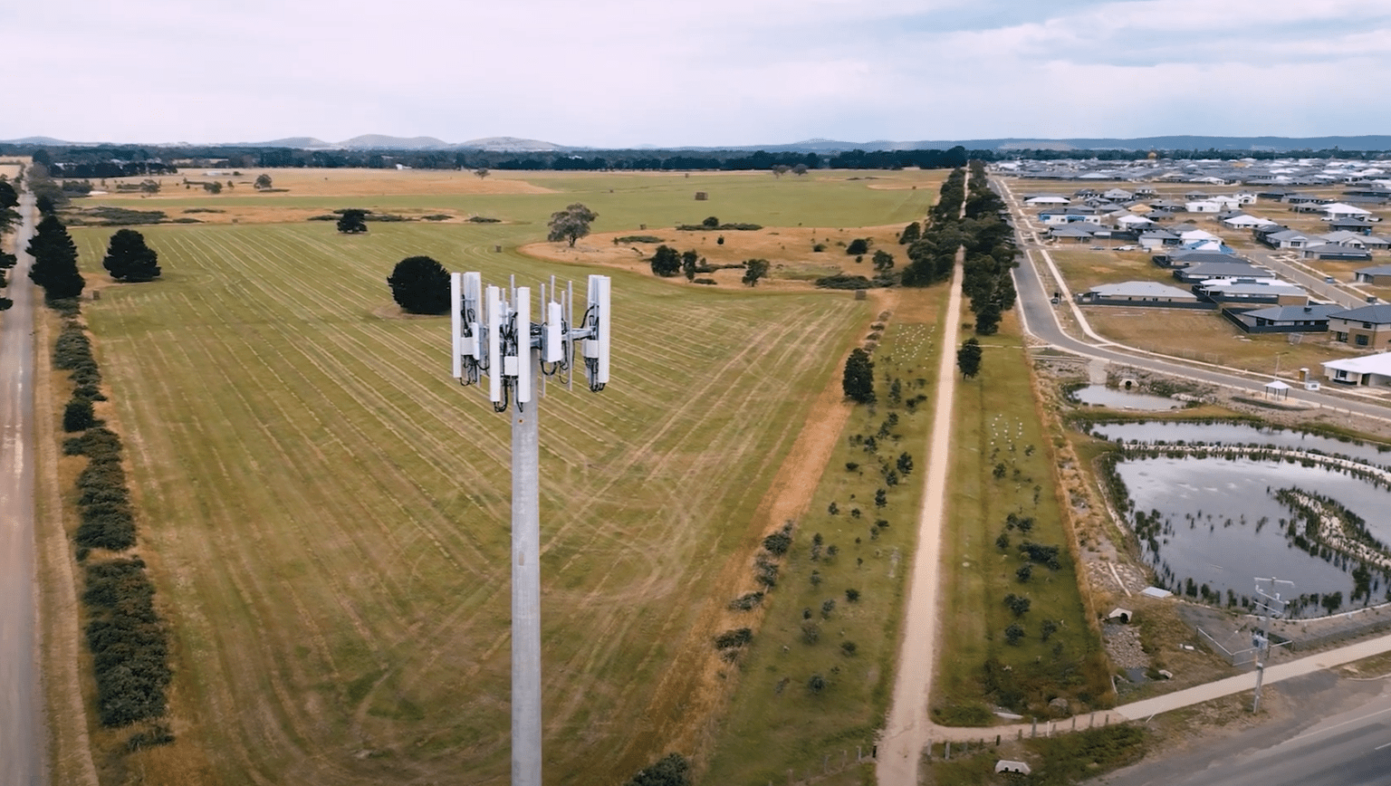 Lucas Ballarat mobile tower Drone view overlooking a mobile tower in a field with Lucas residential area to the right