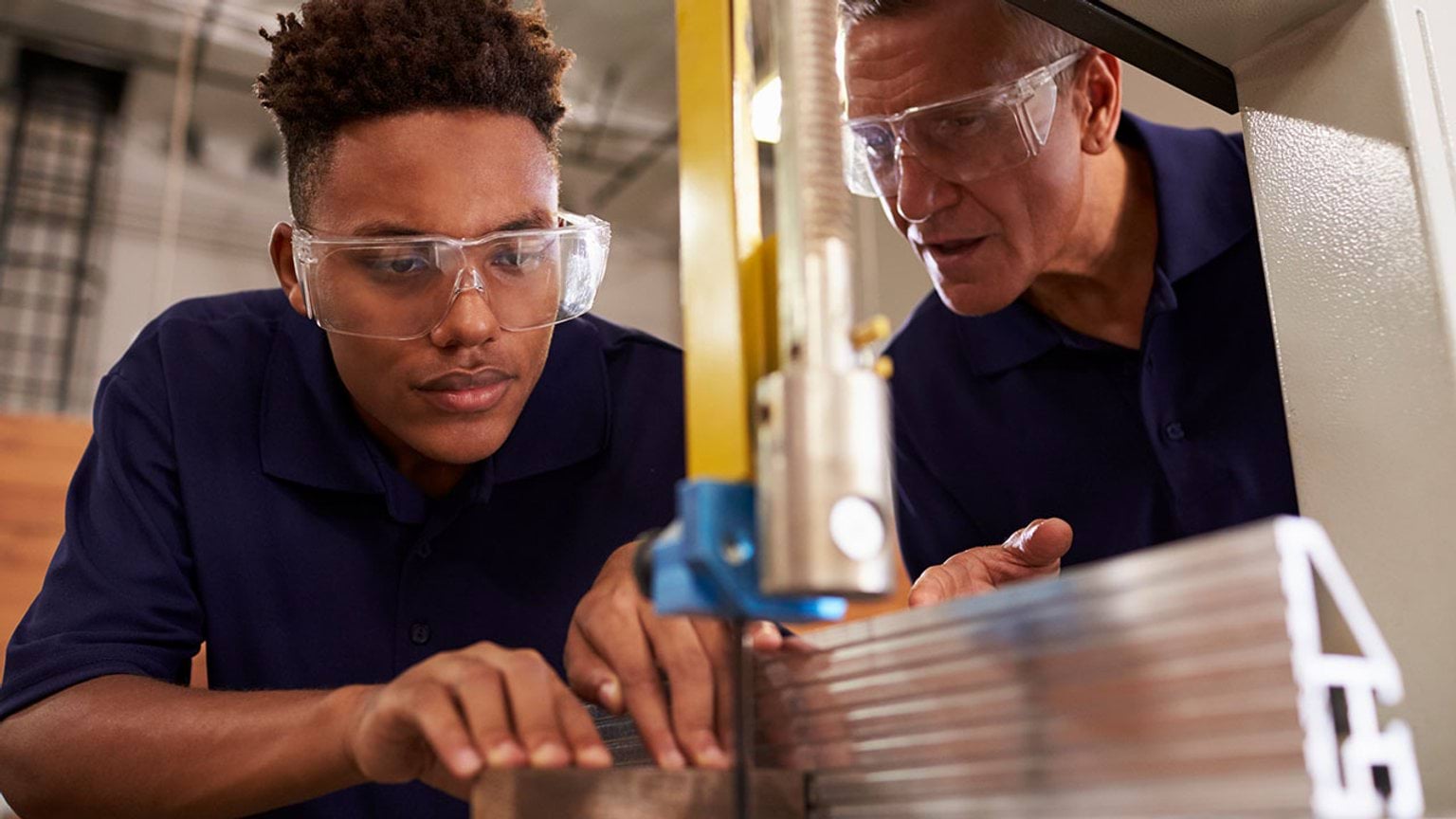 Two people working machine