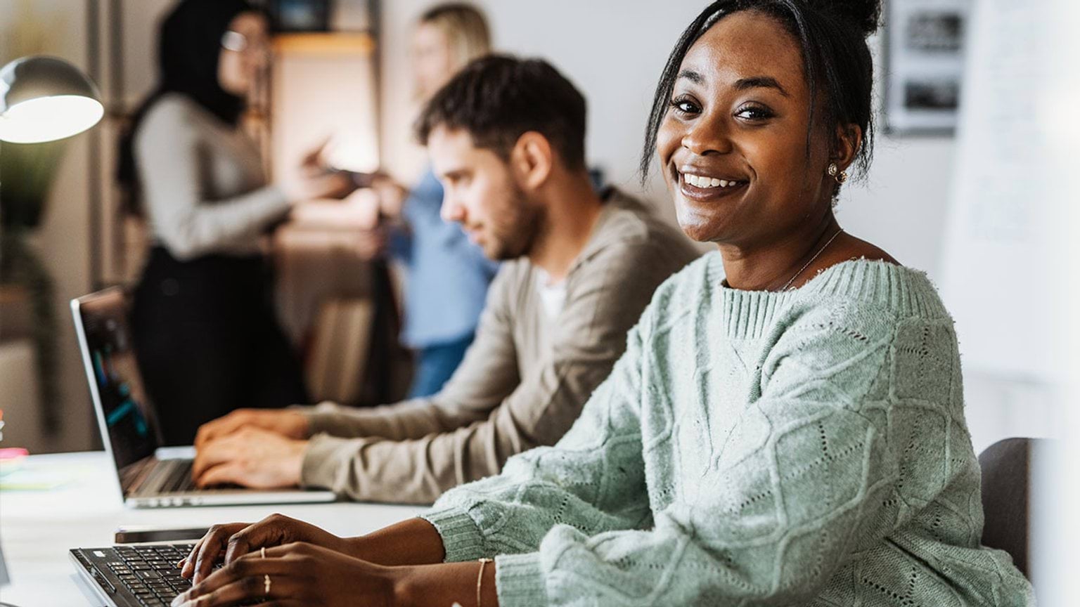 Person looking into the camera in an office setting