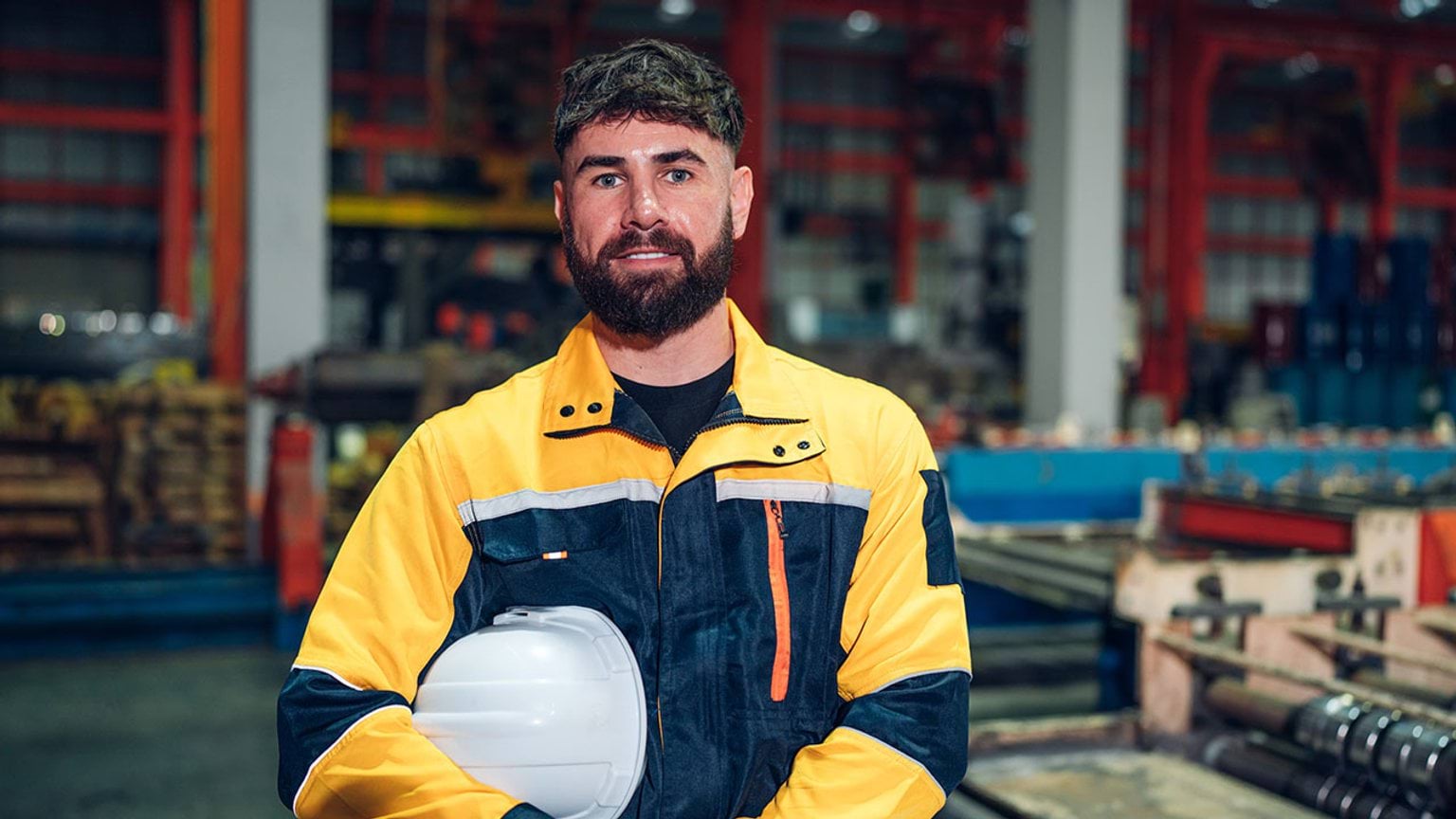 Sheetmetal worker in workshop setting