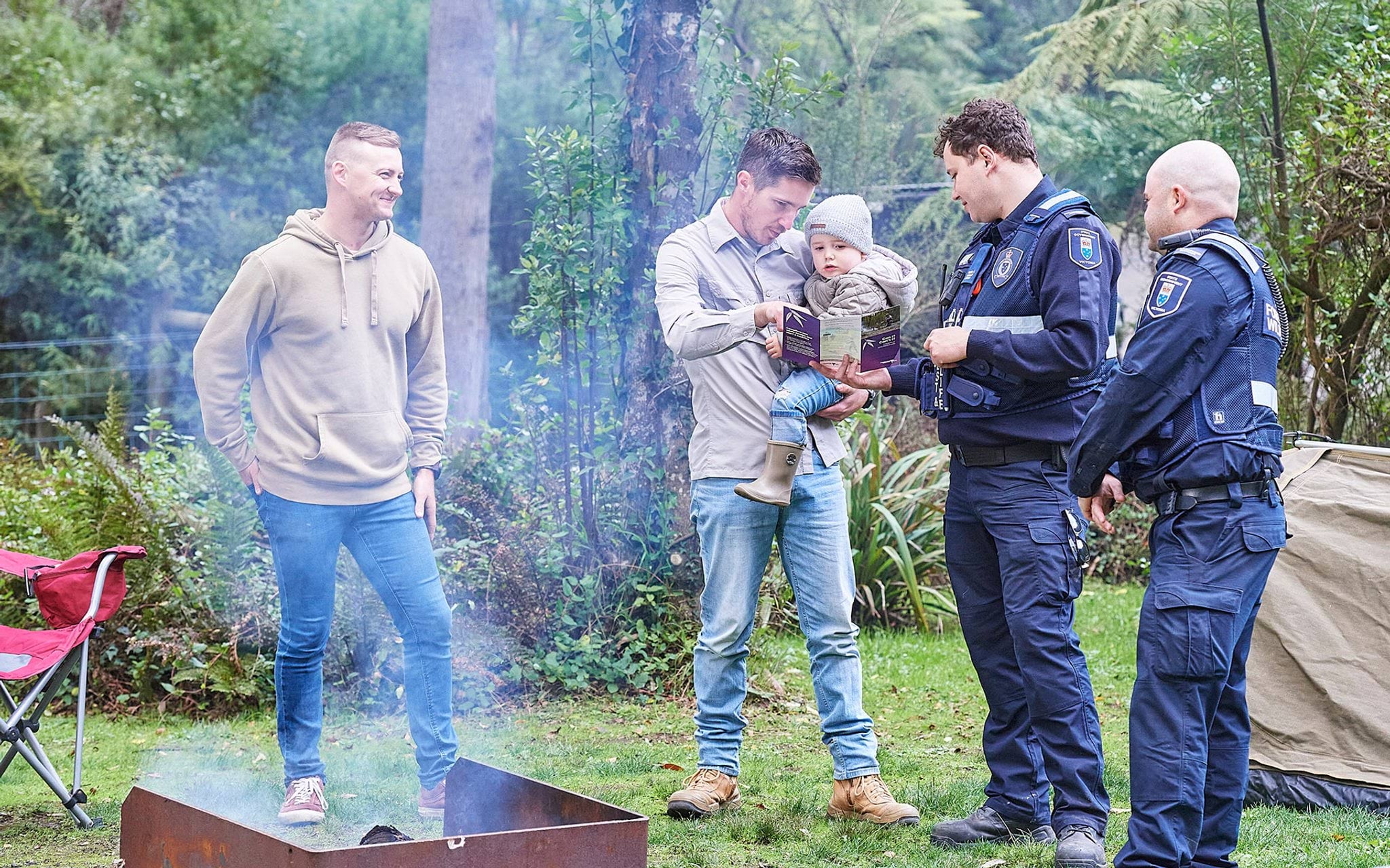 Authorised officers educating campers on campfire compliance Authorised officers educating campers on campfire compliance