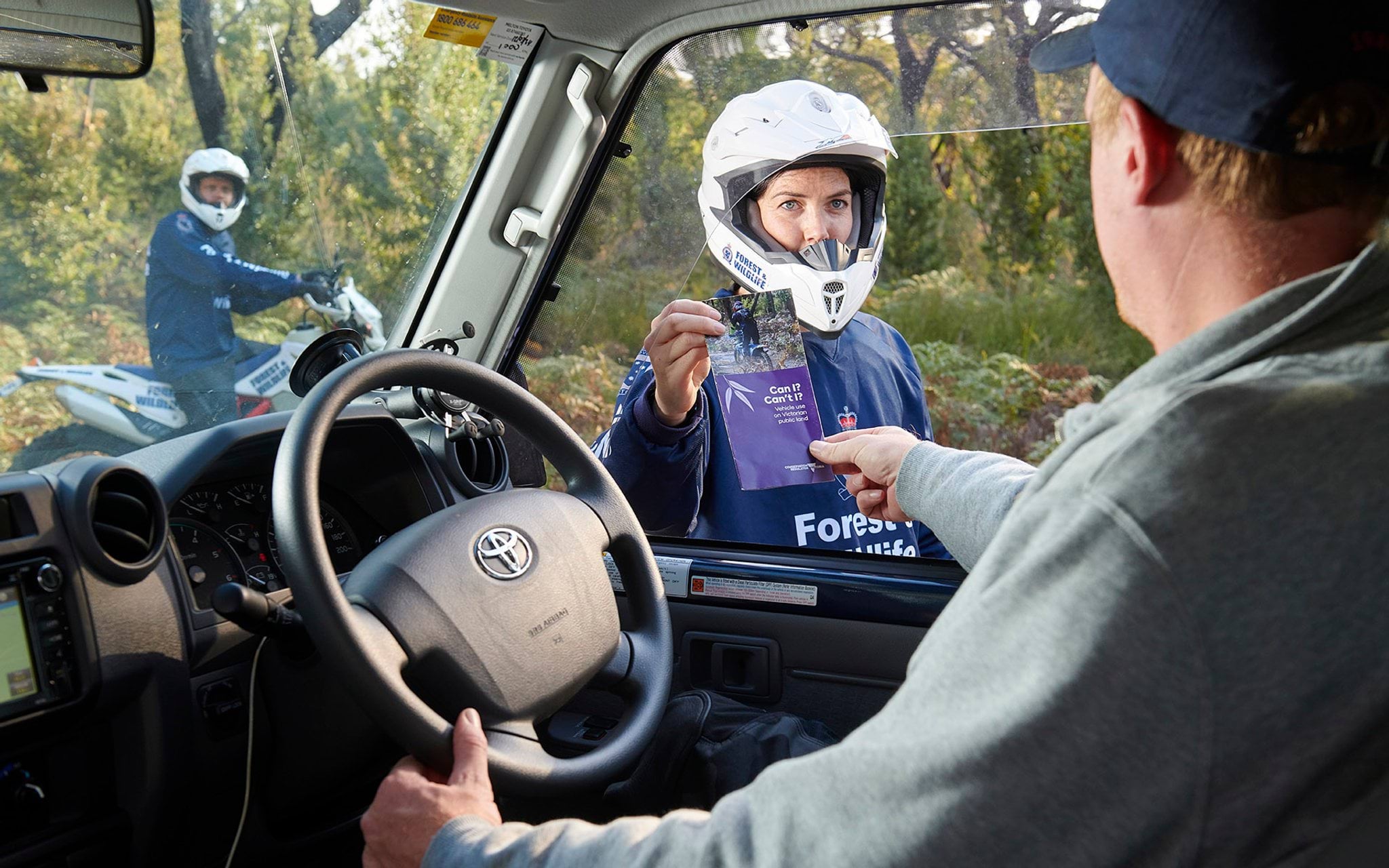 Authorised officer educating driver on vehicle compliance Authorised officer educating driver on vehicle compliance