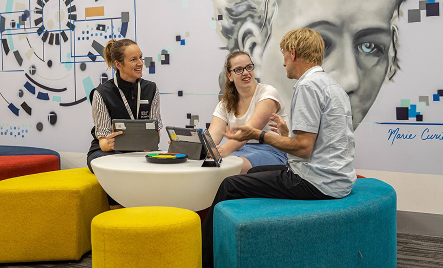 Three people sitting at a table collaborating