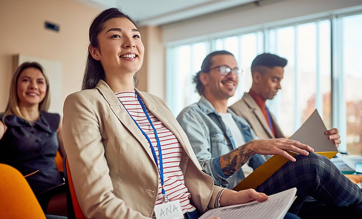 Adults sitting in a classroom setting