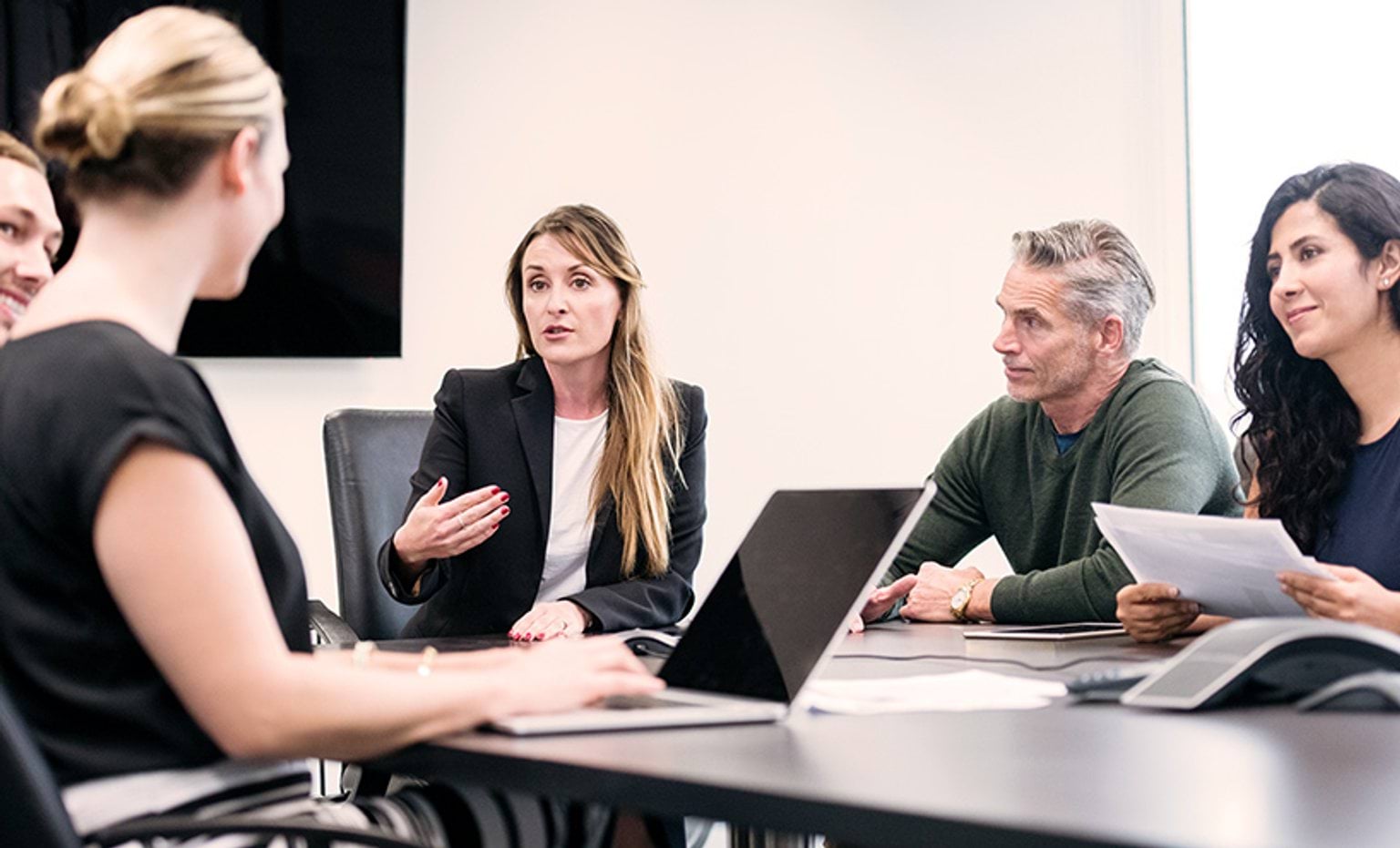 Business people sitting around a table having a meeting