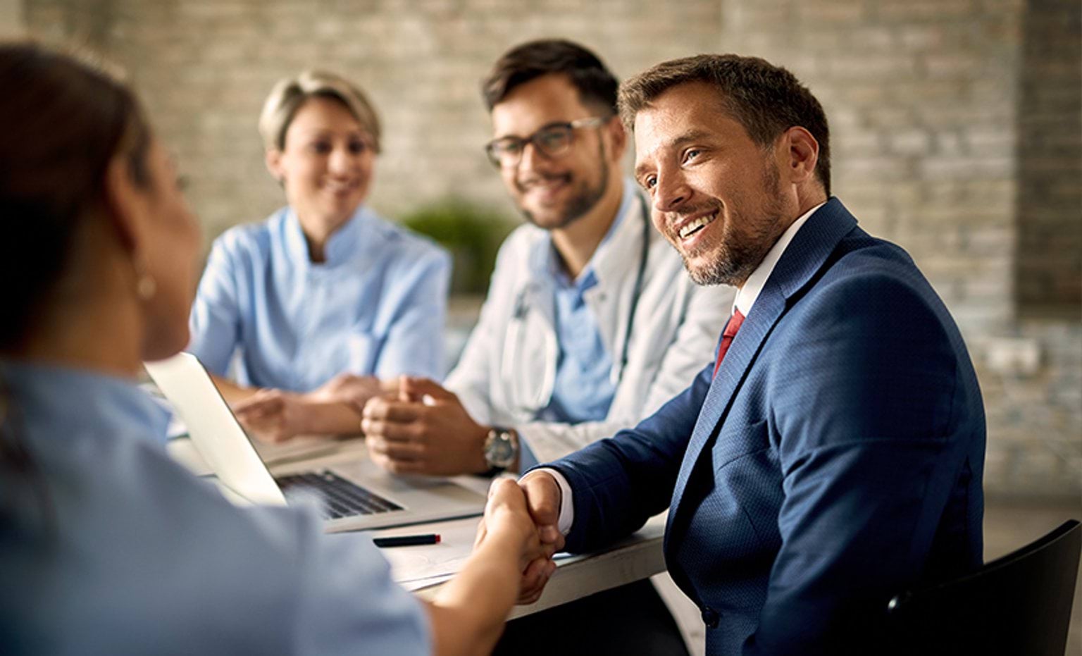 Business people sitting around a table having a meeting