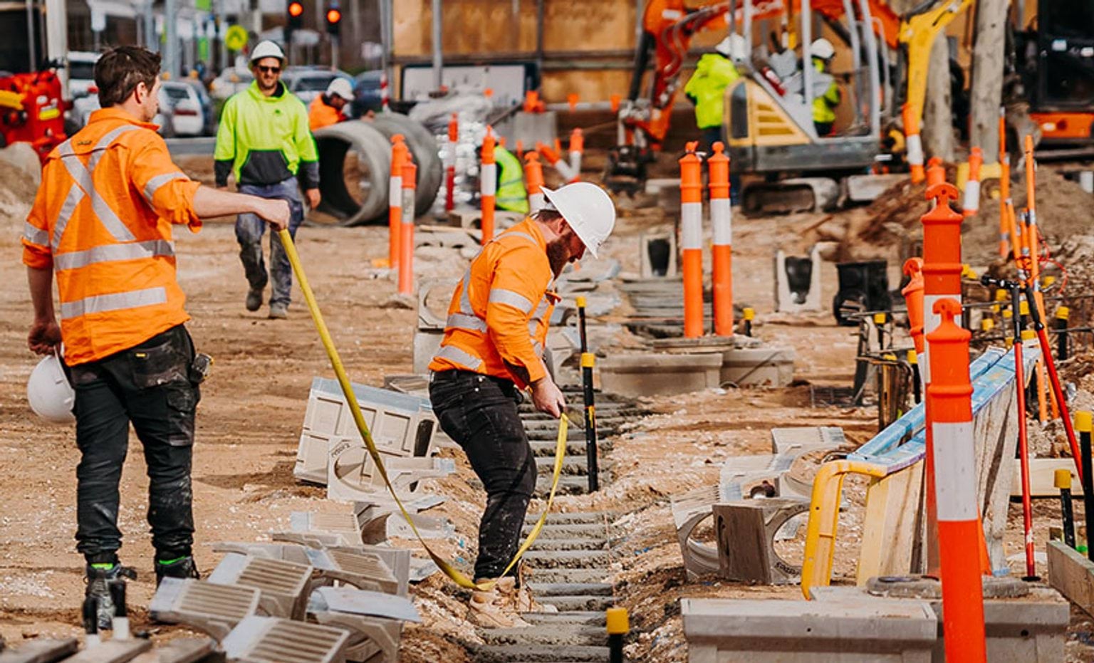 Workers paving at a construction site