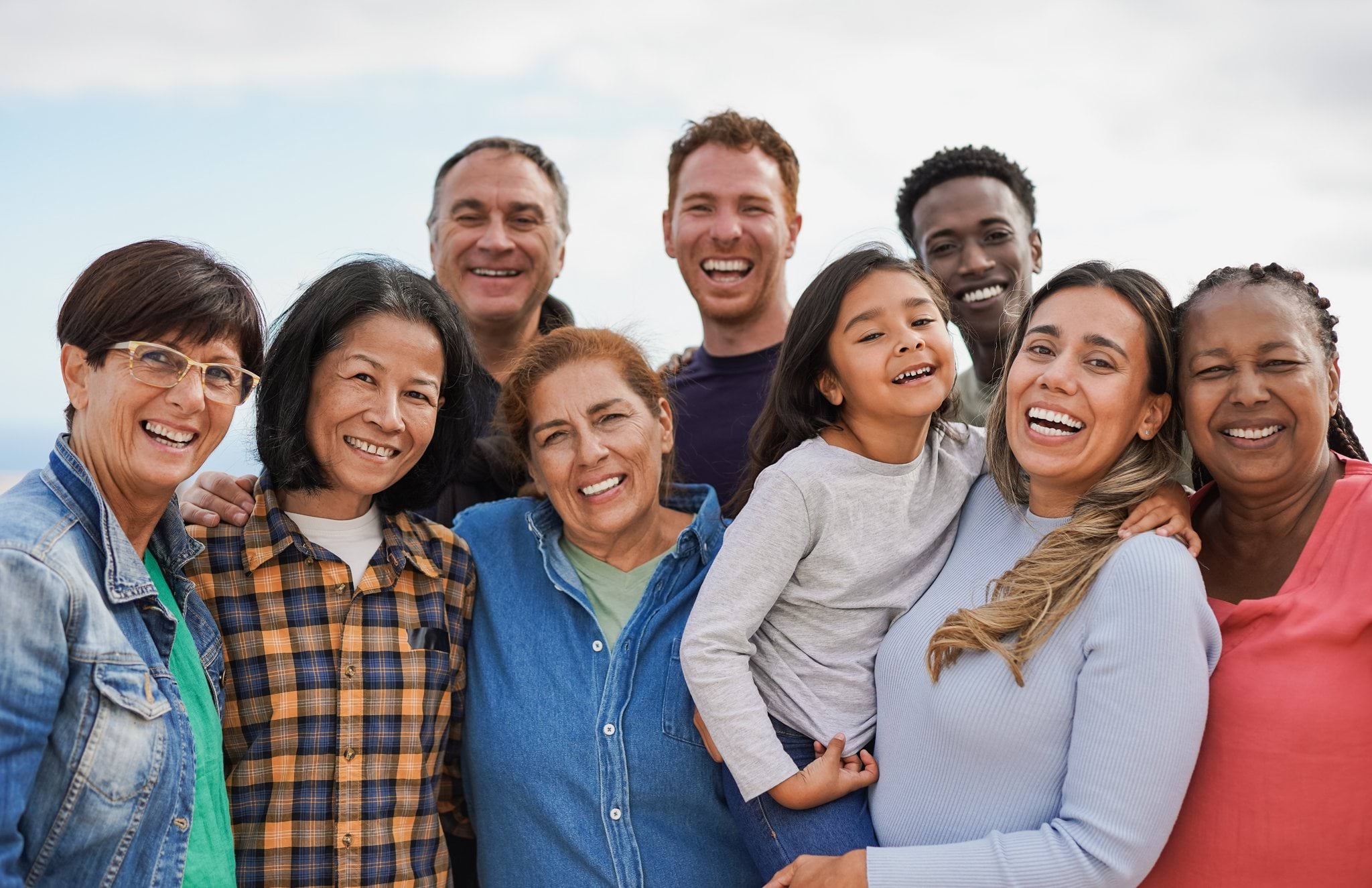 Group of people standing together and smiling