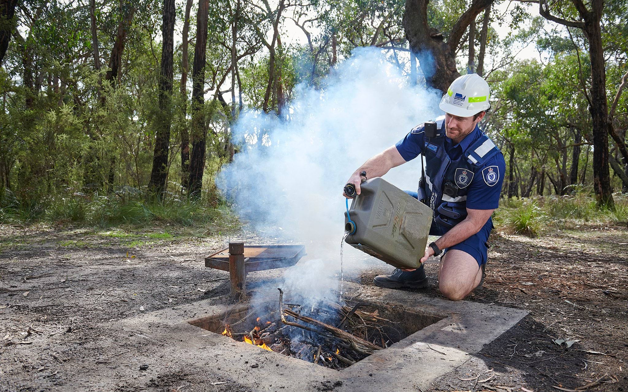 Authorised Officer extinguishing illegal fire on public land Authorised Officer extinguishing illegal fire on public land