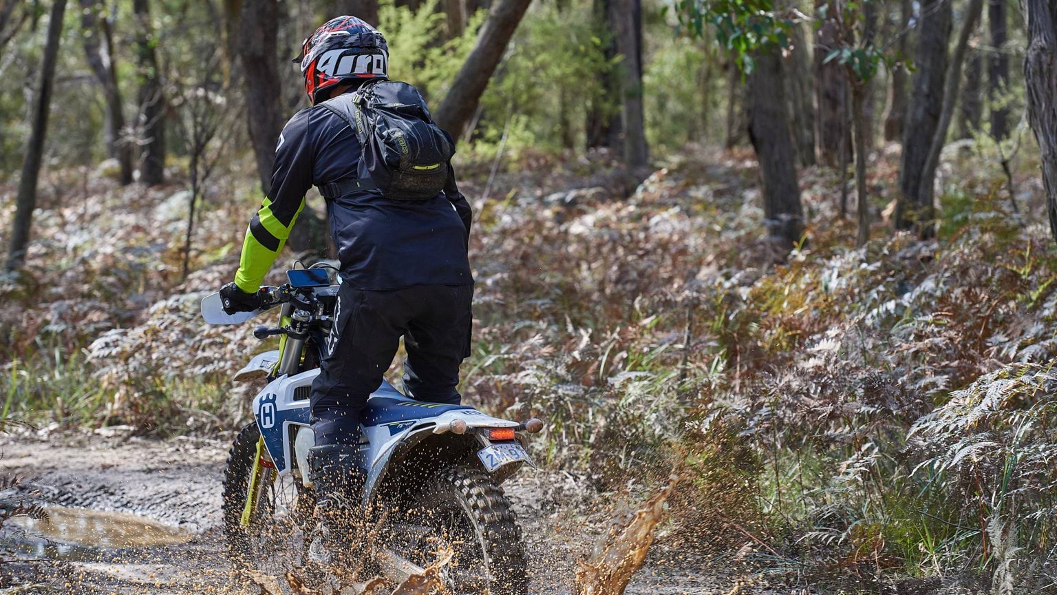 Riding a trailbike on a muddy road within a Victorian Forest. Riding a trailbike on a muddy road within a Victorian Forest.