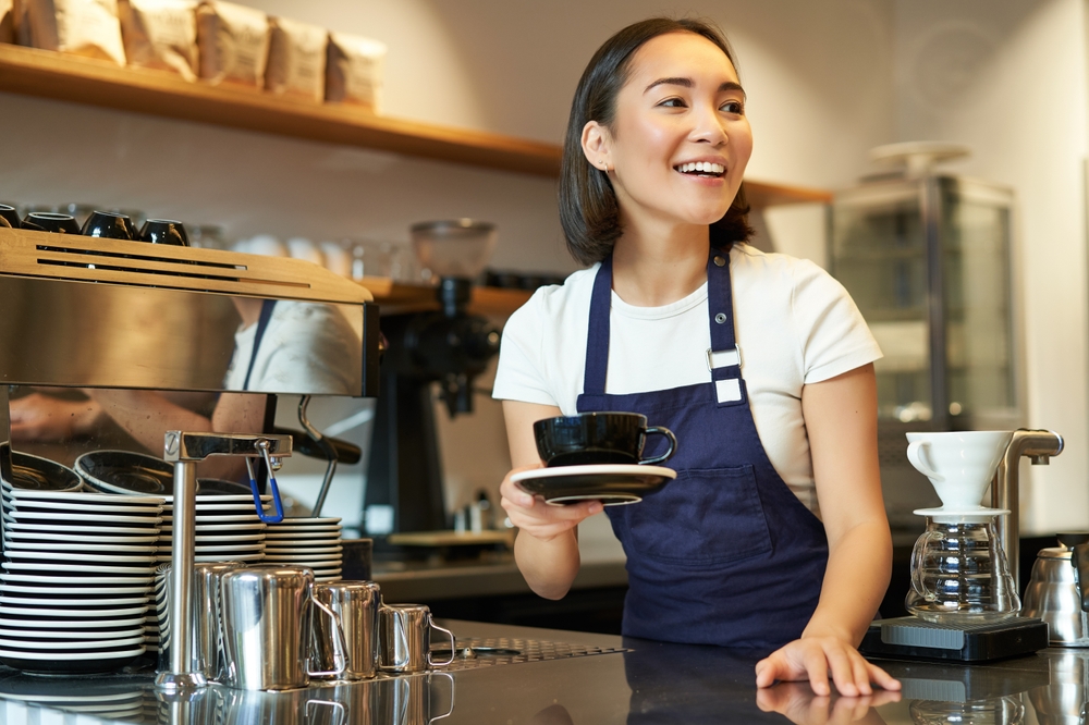 Improving Industry Experience Someone serving coffee